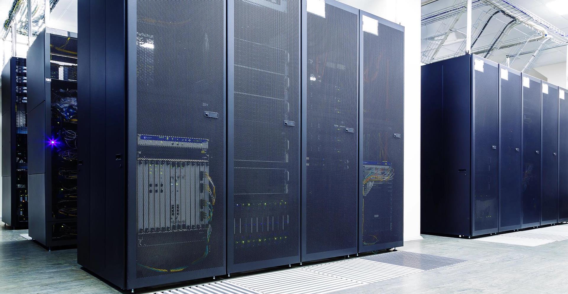 room with rows of server hardware in the data center