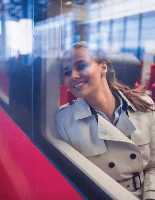 A woman on a train window seat