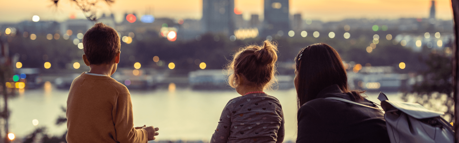 A beautiful sunset over a calm ocean with vibrant orange and pink hues reflecting on the water.