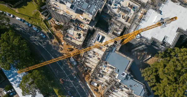 Aerial view of construction site with crane.