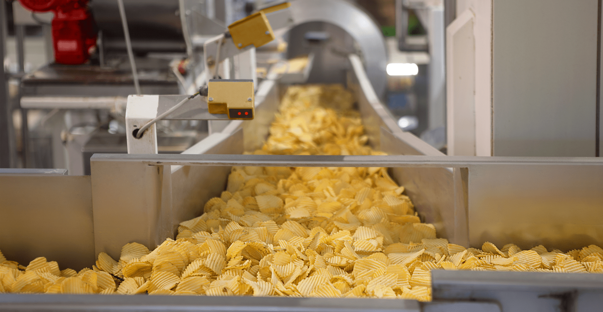A conveyor belt transporting chips during the processing stage in a manufacturing facility.