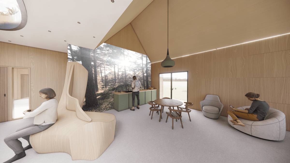 A spacious living room featuring a large window that allows natural light to fill the space.