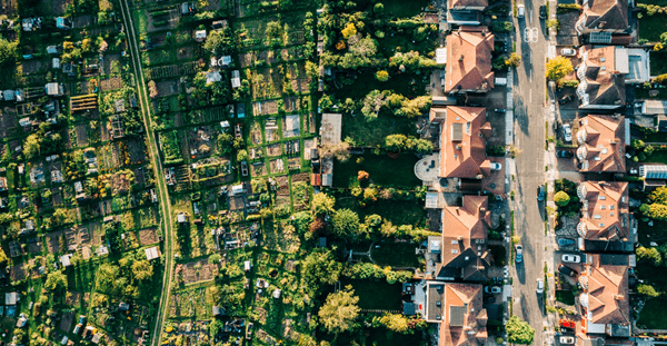 Aerial view of a residential neighborhood with houses and trees, showcasing the beauty of suburban living.