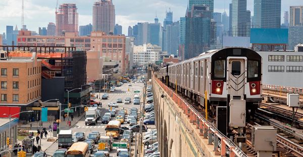 Subway Train Approaching  Elevated Subway Station in Queens, New York