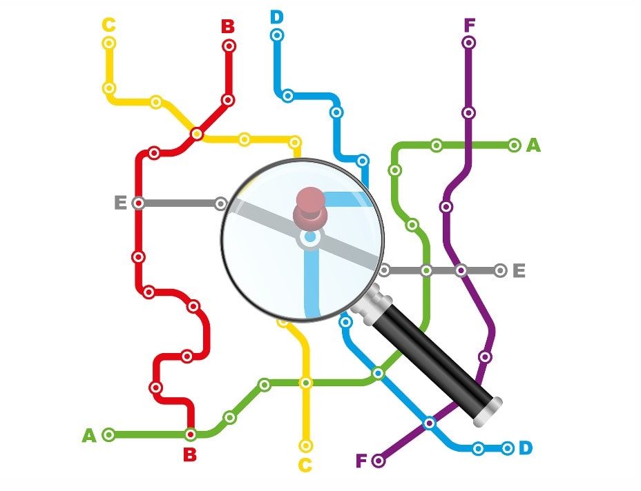 A magnifying glass over a subway map, highlighting intricate details of the transportation system.