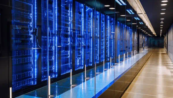 A long hallway with rows of servers in a data center, providing secure storage and processing capabilities.