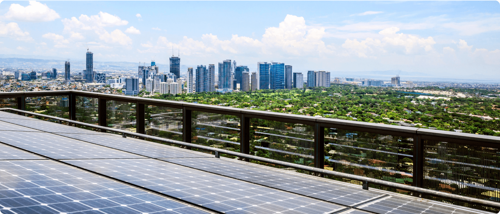Rooftop solar panels harnessing sunlight, with a panoramic view of the cityscape in the background.