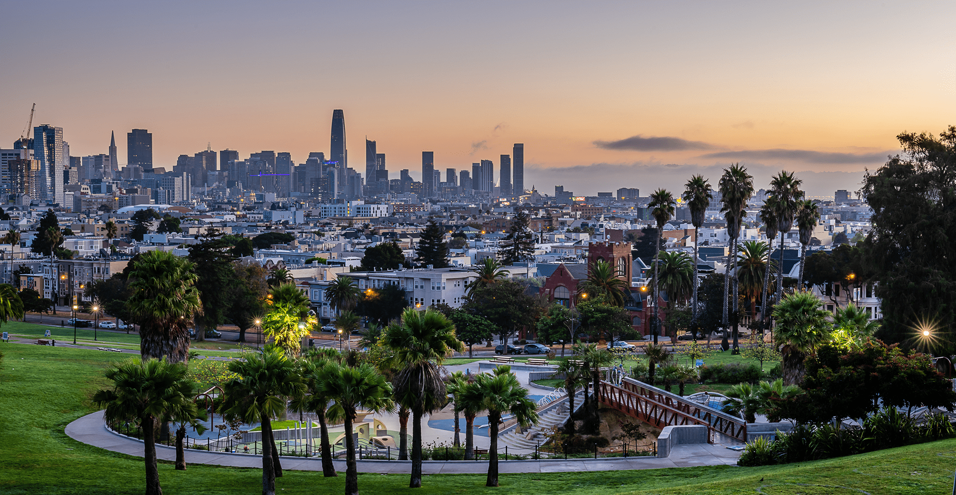 A stunning sunset over the San Francisco skyline, showcasing a blend of warm colors and the city's distinctive architecture.
