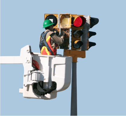 Maintenance man working on a traffic light