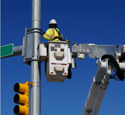 Maintenance man working on a traffic light