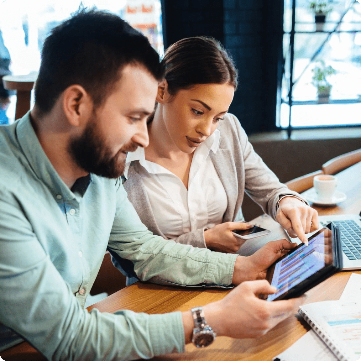 Image of a man and woman using a tablet together.