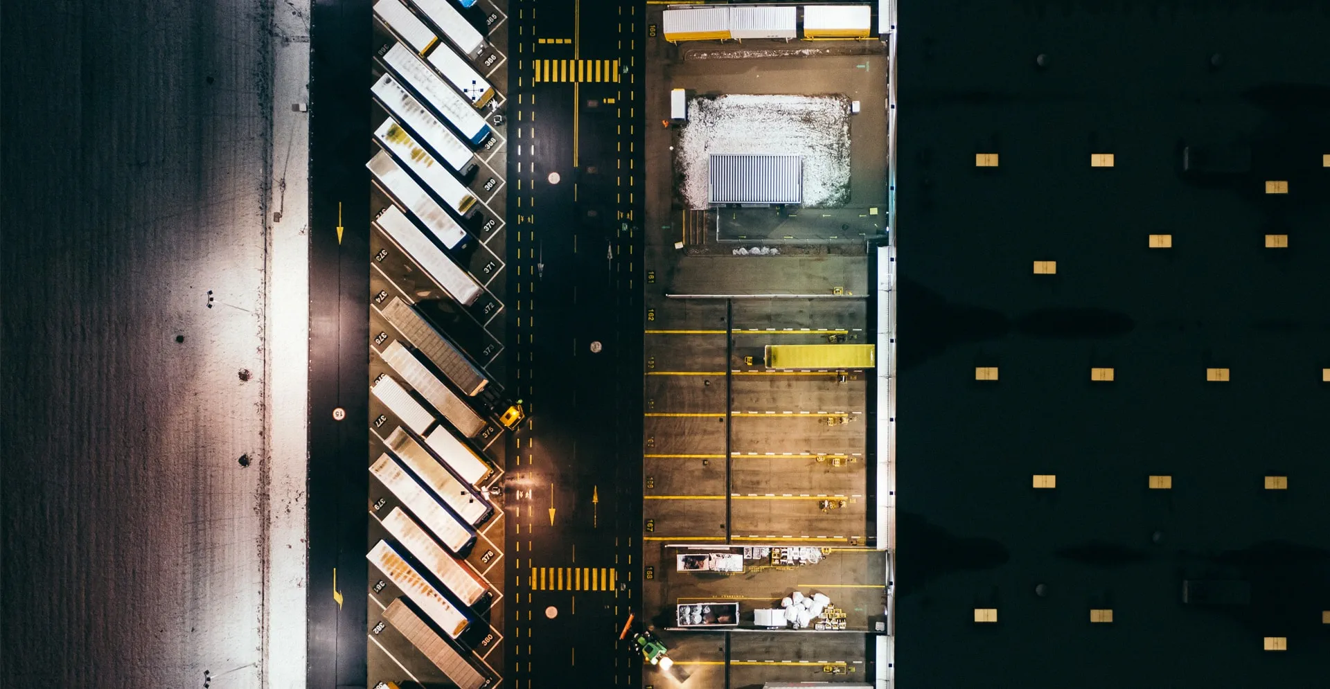Aerial view of the trucks unloading at the logistic center.