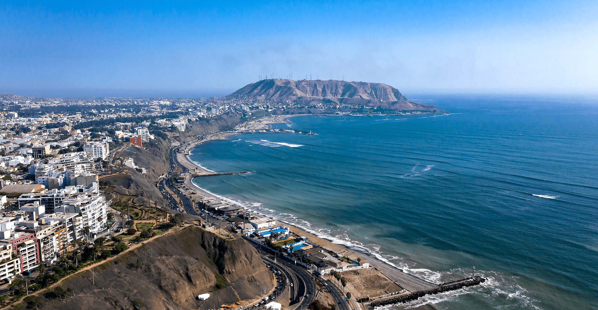 Panoramic view of San Juan, showcasing the vibrant cityscape of Guayaquil, Ecuador under a clear blue sky.