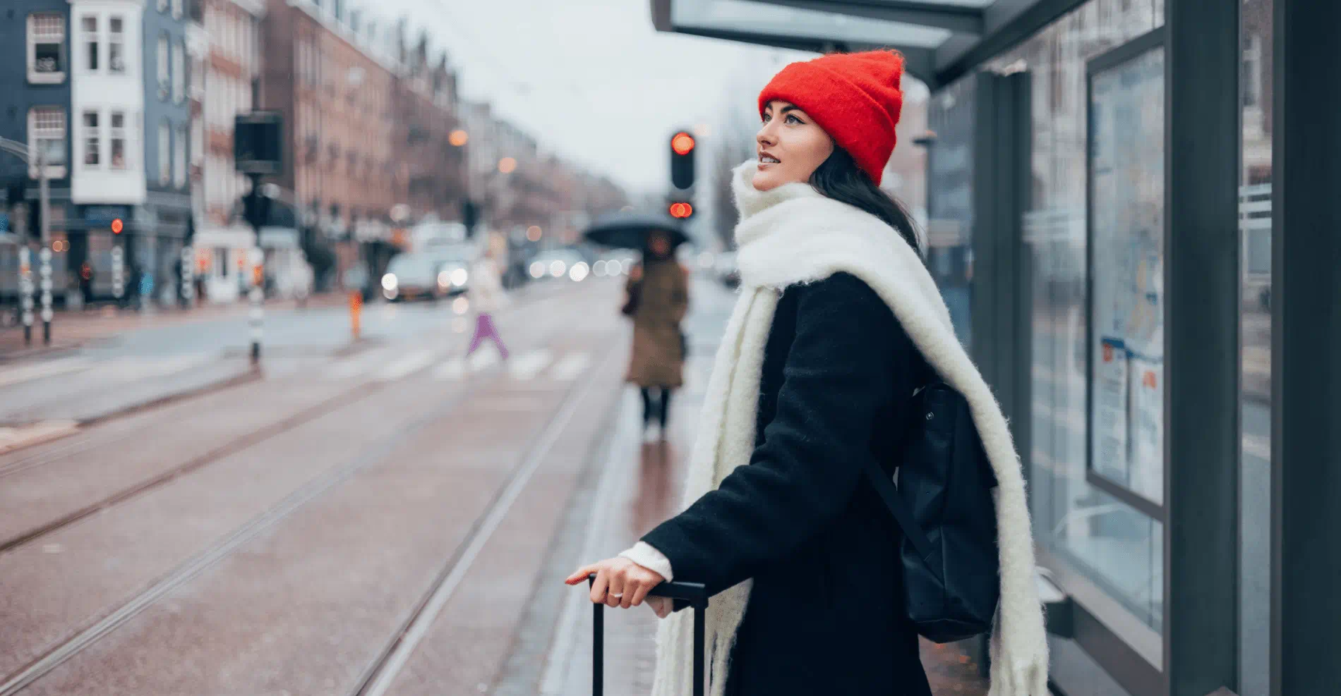  Woman in Winter Outfit Waiting at Bus Stop in Urban City Setting