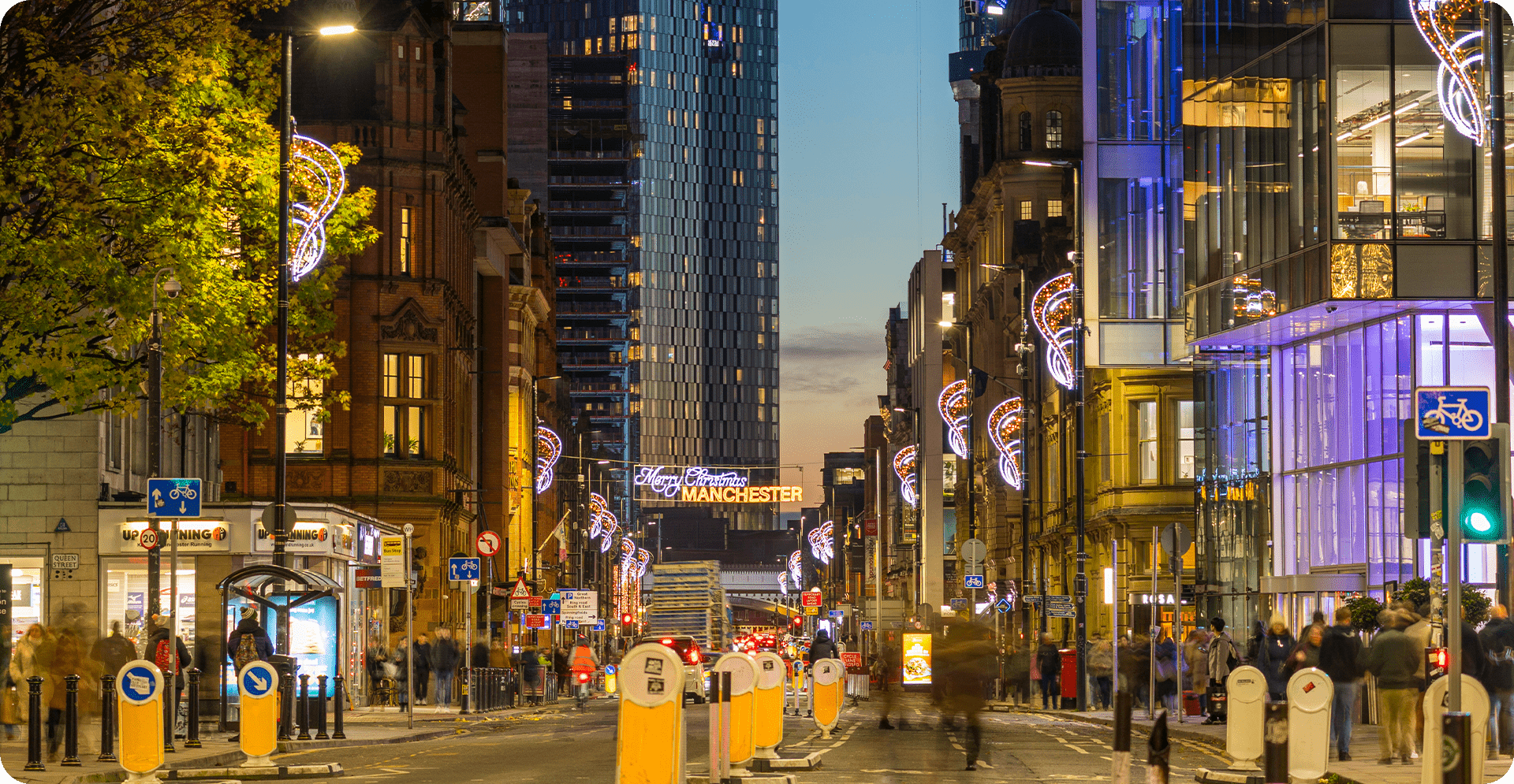 A lively urban street crowded with vehicles and pedestrians, showcasing the energy of city life.