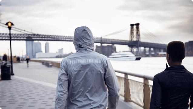 Personal trainer walking in New York Bridge