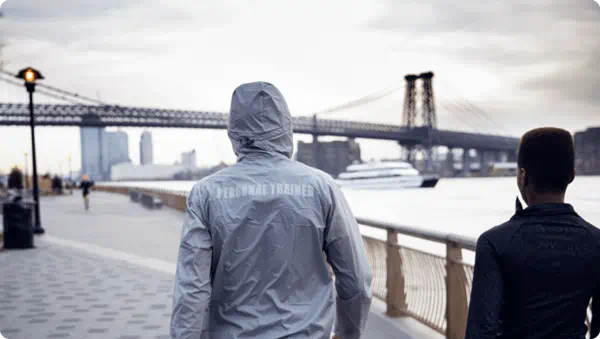 Personal trainer walking in New York Bridge