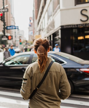 Woman crossing a street in New York
