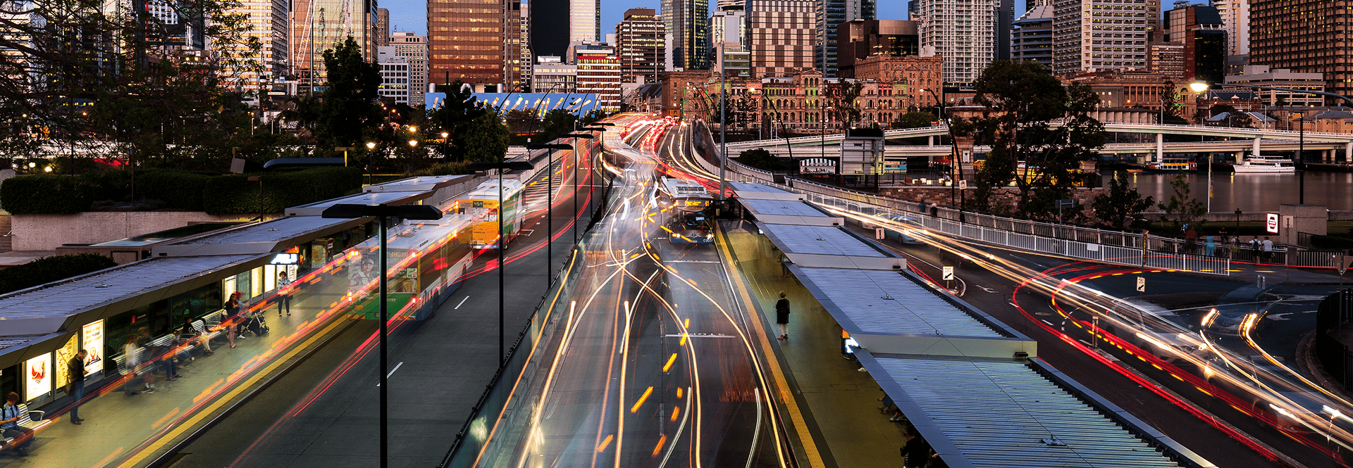 A busy city street filled with various vehicles and heavy traffic during the day.