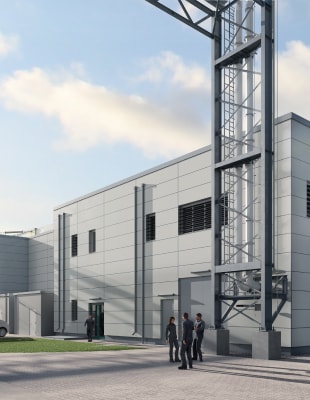 A detailed rendering of a large industrial building showcasing its robust structure and design features.