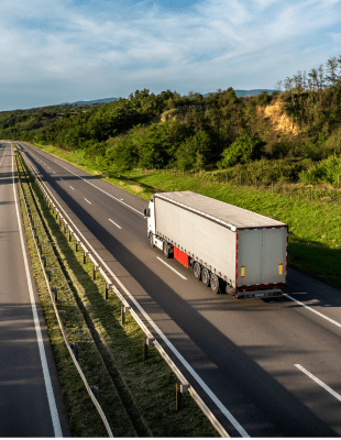 Truck with semi-trailer on highway